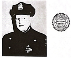 Arthur Brewster in Police uniform with melrose seal to the left of him. 